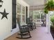 Relaxing porch featuring rocking chairs and access to backyard at 120 Harmony Hill Ln, Cary, NC 27513