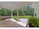 Relaxing front porch featuring wood floors, a swing, and lush greenery at 120 Harmony Hill Ln, Cary, NC 27513