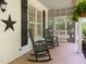 Relaxing porch featuring rocking chairs and access to backyard at 120 Harmony Hill Ln, Cary, NC 27513