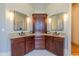 Bathroom featuring a double sink vanity with granite countertop and dark wood cabinetry at 12317 Richmond Run Dr, Raleigh, NC 27614