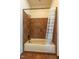 Bathroom featuring a shower/tub combo with tiled walls and neutral shower curtain at 12317 Richmond Run Dr, Raleigh, NC 27614