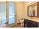 Bathroom with a vanity sink, and a door leading to outdoor area at 12317 Richmond Run Dr, Raleigh, NC 27614