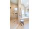 Bathroom featuring a large soaking tub and a tiled walk-in shower. With natural color palette at 12317 Richmond Run Dr, Raleigh, NC 27614