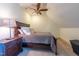 Bedroom featuring a plush bed, nightstand with lamp, and unique angled ceiling at 12317 Richmond Run Dr, Raleigh, NC 27614