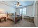 Comfortable bedroom with neutral carpet, ceiling fan, and natural light from the window at 12317 Richmond Run Dr, Raleigh, NC 27614