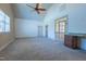 Large bonus room featuring vaulted ceiling, ceiling fan, and built in desk area at 12317 Richmond Run Dr, Raleigh, NC 27614