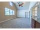 Spacious bonus room with vaulted ceilings, a ceiling fan, and plenty of natural light at 12317 Richmond Run Dr, Raleigh, NC 27614