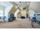 Expansive bonus room with neutral walls and carpet offers flexible design options for various activities at 12317 Richmond Run Dr, Raleigh, NC 27614