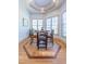 Charming breakfast nook features a round wooden table, four chairs, and a bay window with natural light at 12317 Richmond Run Dr, Raleigh, NC 27614