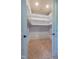 Spacious walk-in closet with built-in shelving and carpet flooring, ready for organization at 12317 Richmond Run Dr, Raleigh, NC 27614