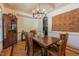Dining room with wooden table, chairs, and beautiful accent wall decor at 12317 Richmond Run Dr, Raleigh, NC 27614