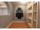 Game nook with built-in shelving and dart board, perfect for recreational activities and storage at 12317 Richmond Run Dr, Raleigh, NC 27614