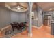 Game room with a dark wood poker table and dark-colored upholstered chairs, great for social gatherings at 12317 Richmond Run Dr, Raleigh, NC 27614
