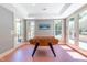Bright game room featuring a classic foosball table with outdoor access to a patio at 12317 Richmond Run Dr, Raleigh, NC 27614