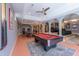 Large game room with pool table, ping pong, and home theater seating, perfect for social gatherings and fun at 12317 Richmond Run Dr, Raleigh, NC 27614