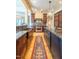 Open kitchen featuring stainless steel appliances, granite countertops and hardwood floors at 12317 Richmond Run Dr, Raleigh, NC 27614