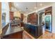 Gourmet kitchen with granite countertops, central island, and stainless steel appliances at 12317 Richmond Run Dr, Raleigh, NC 27614