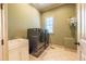 Spacious laundry room with washer, dryer, sink, and window for natural light at 12317 Richmond Run Dr, Raleigh, NC 27614