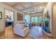 Bright living room with fireplace, coffered ceiling, and open floor plan at 12317 Richmond Run Dr, Raleigh, NC 27614