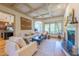 Comfortable living room with a fireplace, neutral furnishings, and natural light at 12317 Richmond Run Dr, Raleigh, NC 27614