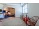 Cozy living room with arched doorway, a bed in the background, and comfortable seating at 12317 Richmond Run Dr, Raleigh, NC 27614