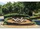 Metal sign in attractive landscaping marks the Wakefield Plantation community entrance at 12317 Richmond Run Dr, Raleigh, NC 27614