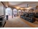 Home theater with tiered seating, projector, and screen, perfect for movie nights and entertainment at 12317 Richmond Run Dr, Raleigh, NC 27614