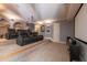 Home theater with tiered seating and projector providing an immersive cinematic experience at 12317 Richmond Run Dr, Raleigh, NC 27614