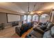 Home theater with tiered seating, projector, and large screen for an immersive entertainment experience at 12317 Richmond Run Dr, Raleigh, NC 27614