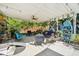 A large outdoor back porch with a ceiling fan and comfortable seating at 1315 Brigham Rd, Chapel Hill, NC 27517