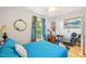 Bright bedroom with hardwood floors, natural light, colorful curtains and ceiling fan at 1315 Brigham Rd, Chapel Hill, NC 27517
