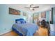 This bedroom is brightly lit and features a ceiling fan, desk and comfortable bed at 1315 Brigham Rd, Chapel Hill, NC 27517
