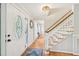 Welcoming entryway features a decorative front door, hardwood floors, and a staircase at 1315 Brigham Rd, Chapel Hill, NC 27517