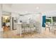 Open kitchen with breakfast bar, stainless steel appliances, and an open design to a dining area at 1315 Brigham Rd, Chapel Hill, NC 27517