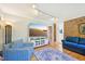 Living room with fireplace, hardwood floors, television, and comfortable seating at 1315 Brigham Rd, Chapel Hill, NC 27517