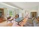 This living room has hardwood floors, comfortable seating and lots of natural light at 1315 Brigham Rd, Chapel Hill, NC 27517