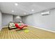Finished basement featuring striped carpet, modern furniture, and recessed lighting at 140 Sunstone Dr, Cary, NC 27519