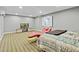 Finished basement area with striped carpet, modern furniture, and recessed lighting at 140 Sunstone Dr, Cary, NC 27519