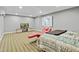 Finished basement featuring unique chaise lounge seating area and striped carpeting at 140 Sunstone Dr, Cary, NC 27519