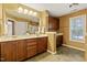 Spacious bathroom featuring a double vanity, a large mirror, and neutral color walls at 140 Sunstone Dr, Cary, NC 27519