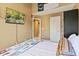 Bedroom with a television, high ceilings, painted walls, and a comfortable bed with patterned covers at 140 Sunstone Dr, Cary, NC 27519