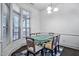 Sunlit dining room features a glass-top table, six chairs, and large windows at 140 Sunstone Dr, Cary, NC 27519