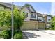 Charming townhome features a two-car garage, stone accents, and well-manicured landscaping at 140 Sunstone Dr, Cary, NC 27519