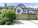 Charming townhome features a two-car garage, stone accents, and well-manicured landscaping at 140 Sunstone Dr, Cary, NC 27519