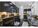 Kitchen with dark cabinets, a gas range, granite countertops, and stainless steel appliances at 140 Sunstone Dr, Cary, NC 27519
