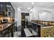 Kitchen featuring dark cabinets, stainless steel appliances, and decorative backsplash at 140 Sunstone Dr, Cary, NC 27519