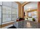 Bright kitchen featuring granite countertops, a large window, and an open layout leading to a living area at 140 Sunstone Dr, Cary, NC 27519
