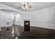 Open living room with a ceiling fan, dark hardwood floors, and a cozy fireplace at 140 Sunstone Dr, Cary, NC 27519