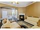 Inviting living room boasts a fireplace, dark hardwood floors, and comfortable seating arrangements at 140 Sunstone Dr, Cary, NC 27519