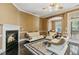 Cozy living room includes a fireplace, dark hardwood floors, and comfortable seating area at 140 Sunstone Dr, Cary, NC 27519